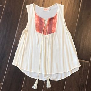 Cute top with orange embroidery. Fits like a small